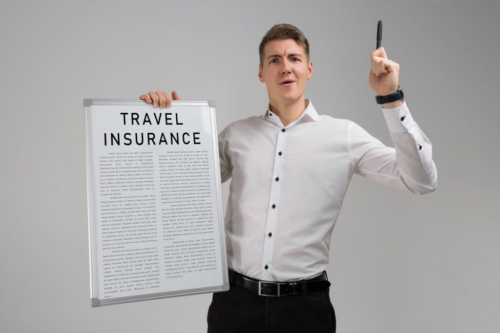 Young man holding a travel insurance list isolated on light background